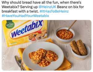 Weetabix cereal on a table with a bowl of baked beans